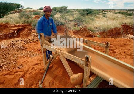 Diamond miner small digger sifting, South Africa. Stock Photo