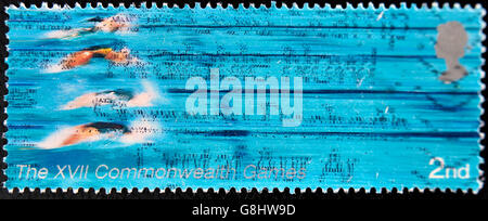 UNITED KINGDOM - CIRCA 2005: A Stamp printed in Great Britain showing swimmers, XVI commonwealth games, circa 2005 Stock Photo