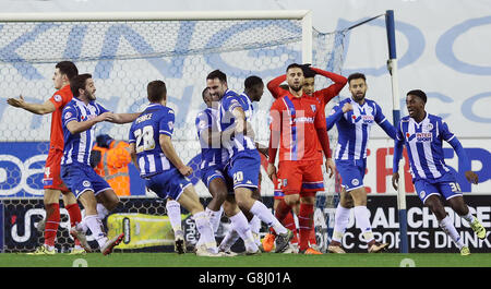 Wigan Athletic's Craig Morgan (centre) celebrates scoring his side's ...