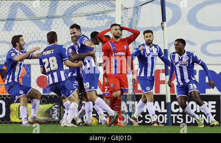 Wigan Athletic's Craig Morgan (centre) celebrates scoring his side's ...