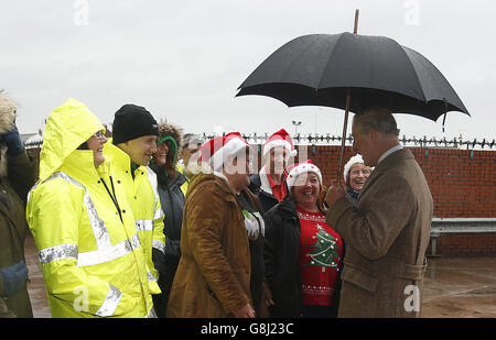The Prince of Wales talks to well wishers during a visit to the McVitie's factory in Carlisle, which was damaged in the floods earlier in the month. Stock Photo