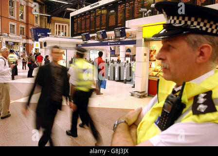 British Transport Police officers on the concourse at central London's Victoria railway station. Britain's most senior police officer today defended the specialist firearms officers who who shot dead an innocent Brazilian man they had mistaken for a suicide bomber. Metropolitan Police Commissioner Sir Ian Blair said the officers who shot Jean Charles de Menezes at Stockwell Tube station last week would have thought they faced the risk of 'certain death'. They 'clearly thought' they were dealing with a suicide bomber, and yet they still ran towards him, he said. Stock Photo