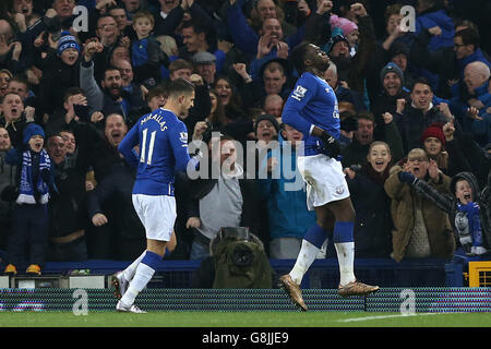 Everton's Romelu Lukaku (right) celebrates scoring his sides second goal of the game during the Capital One Cup, semi final, first leg match at Goodison Park, Liverpool. Stock Photo