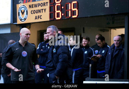 Blackburn Rovers manager Paul Lambert listens to referee Charles Breakspear as he calls the match off due to a waterlogged pitch, during the Emirates FA Cup, third round game at Rodney Parade, Newport. Stock Photo