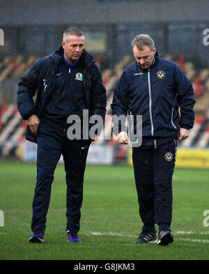 Blackburn Rovers' Manager Paul Lambert with Newport County Manager John Sheridan (right) after referee Charles Breakspear had called the match off due to waterlogged pitch, during the Emirates FA Cup, third round game at Rodney Parade, Newport. Stock Photo