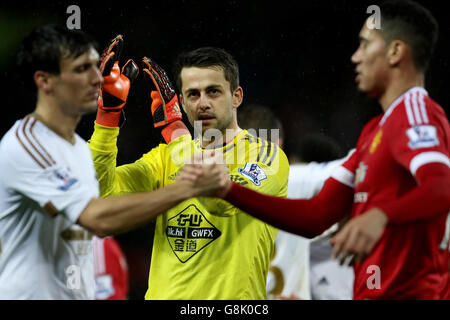 Manchester United v Swansea City - Barclays Premier League - Old Trafford. Swansea City goalkeeper Lukasz Fabianski applauds the away support Stock Photo