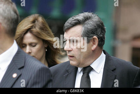 Gordon Brown and wife Sarah arrive for the funeral of former Foreign Secretary Robin Cook. Cook, 59, died on Saturday while on a walking holiday with his wife Gaynor in northern Scotland. Stock Photo