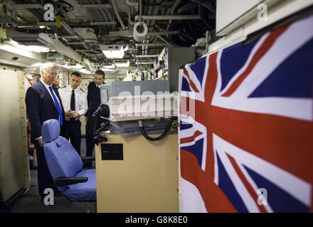Defence Secretary Michael Fallon in the Missile Control Centre during a visit to Vanguard-class submarine HMS Vigilant, one of the UK's four nuclear warhead-carrying submarines, at HM Naval Base Clyde, also known as Faslane, in Scotland. Stock Photo
