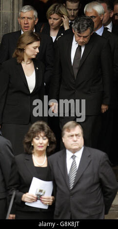 Gordon Brown and his wife Sarah (top) with John Prescott and his wife Pauline (foreground) leave after the funeral of former Foreign Secretary Robin Cook. Cook, 59, died on Saturday while on a walking holiday with his wife Gaynor in northern Scotland. Stock Photo