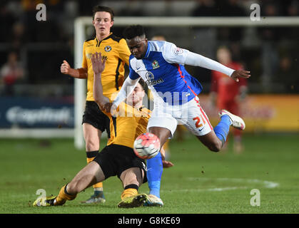 Blackburn Rovers' Hope Akpan is tackled by Newport County's Andrew Hughes during the Emirates FA Cup, third round match at Rodney Parade, Newport. Stock Photo