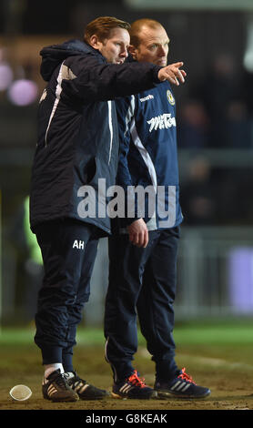 Newport County manager Warren Feeney with coach Andy Todd (left) during the Emirates FA Cup, third round match at Rodney Parade, Newport. Stock Photo
