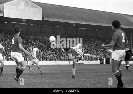 Nottingham Forest's Peter Withe (second r) flicks a header goalwards, watched by teammate John O'Hare (second l) and Orient's Glenn Roeder (l) Stock Photo