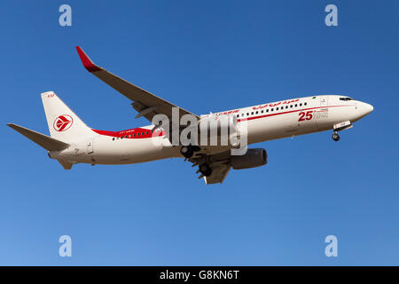 An Air Algerie Boeing 737-800 approaching to El Prat Airport in Barcelona, Spain. Stock Photo