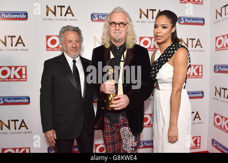 Sarah Jane Crawford with Dustin Hoffman presenting Billy Connolly with the Special Recognition Award pictured backstage at the National Television Awards 2016, at the O2 Arena, London. PRESS ASSOCIATION Photo. Picture date: Wednesday January 20, 2016. Photo credit should read: Matt Crossick/PA Wire. Stock Photo