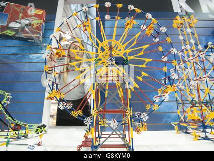 The Toy Fair 2016. A visitor to the Toy Fair 2016 looks at a Classic Ferris Wheel by K'NEX at Olympia in London. Stock Photo