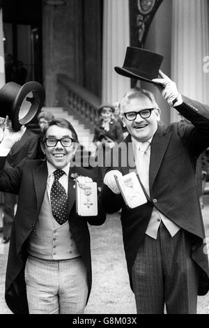 Smiles from television's Two Ronnies, comedians Ronnie Corbett (l) and Ronnie Barker, at Buckingham Palace after receiving the OBE from Queen Elizabeth II at an investiture. Stock Photo