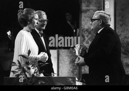 Princess Anne presenting the best comedy performance award to Ronnie Barker at the Wembley Conference Centre when, as Academy patron, she presented the British Academy of Film and Television Arts annual awards. Ronnie won the award for 'Going Straight' and for his partnership with Ronnie Corbett in their The Two Ronnies show. Stock Photo