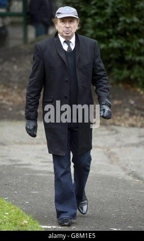 Adrian Juste attends the funeral of the former disc jockey and TV presenter DJ Ed 'Stewpot' Stewart, taking place at St Peter's Church in Bournemouth. Stock Photo