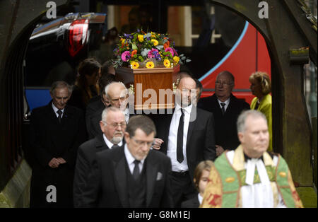 The coffin of DJ Ed 'Stewpot' Stewart is carried, as the funeral of the former disc jockey and TV presenter takes place at St Peter's Church in Bournemouth. Stock Photo