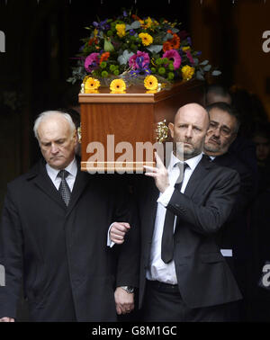 The coffin of DJ Ed 'Stewpot' Stewart is carried, as the funeral of the former disc jockey and TV presenter takes place at St Peter's Church in Bournemouth. Stock Photo