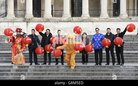 London Chinatown Chinese Association welcomes in the Year of the Monkey in London's Trafalgar Square with displays including a lion dance and traditional costumes . Stock Photo