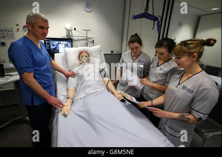 Pictured is a medical scenario at the Alexander Fairley Clinical Skills Area with Practise Educators Kevin Lang with student nurses Peggy Smith(second from left), Alexandra McKinstry and Emma Kristoffersen(far right) as they carry out a medical scenario using a mannequin at the Queen Elizabeth University Hospital in Glasgow, Nicola Sturgeon also toured labs where medical students are working on new ways to extract DNA to provide personal treatment for patients. Stock Photo