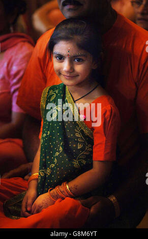 Three-year-old Komal Madh attends Janmashtami, a festival celebrating the birthday of the Hindu deity Lord Krishna in Aldenham, Watford Friday August 26, 2005. It is the largest gathering of Hindus outside India with 75,000 people expected to take part. The celebration marks the 5,000-year-old festival of Janmashtami, the birthday of Lord Krishna who is the reincarnation of Lord Vishnu. See PA story RELIGION Hindu. PRESS ASSOCIATION Photo. Photo credit should read: Fiona Hanson/PA. Stock Photo