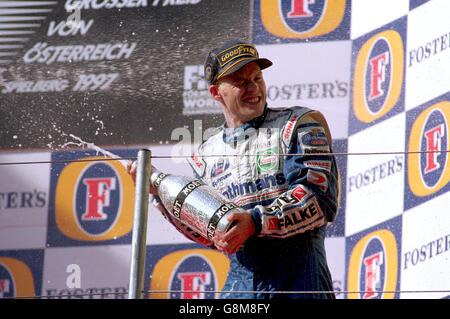 Jacques Villeneuve sprays champagne after winning the Austrian Grand ...