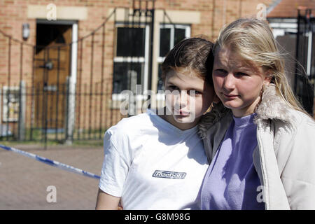 Eye witnesses who tried to help the mother of the baby killed in a house fire, Chantelle stoker, 12 (left) and friend Leanne Horspool, 15, gather outside the house on Link road in Cowgate, Monday August 29 2005, as a murder inquiry was launched. Northumbria Police said fire crews were called to a blaze in Link Road, Cowgate, Newcastle, last night and rescued a 21-year-old woman and her four-month-old son. A spokesman said the baby died shortly after in hospital. See PA story POLICE Baby. PRESS ASSOCIATION Photo. Photo credit should read: Owen Humphries/PA Stock Photo