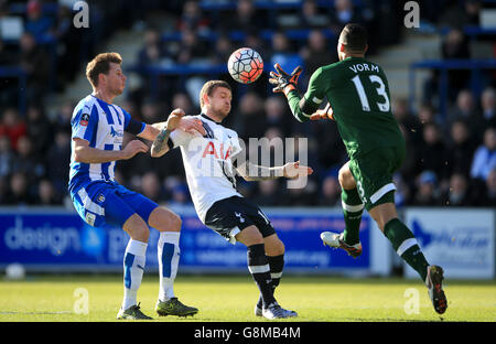 Tottenham Hotspur's Kieran Trippier (centre) and goalkeeper Michel Vorm battle for the ball with Colchester United's Chris Porter (left) during the Emirates FA Cup, fourth round match at the Weston Homes Community Stadium, Colchester. Stock Photo