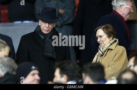Sir Bobby Charlton and his wife Norma Ball (right) before the Barclays Premier League match at Old Trafford, Manchester. Stock Photo