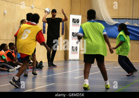 Rio Ferdinand, Founder and Trustee of the Rio Ferdinand Foundation joins in with young people during a visit to one of the Foundation's training and youth programmes. Stock Photo