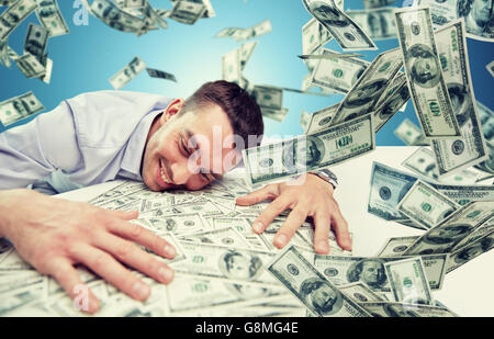 happy businessman with heap of money Stock Photo