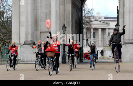 Cyclists with beach props pass through Wellington Arch in London, riding retro bicycles, to launch the British Heart Foundation (BHF) London to Brighton Bike Ride, in association with Tesco and Jaffa, which takes place on Sunday June 19 2016. Stock Photo