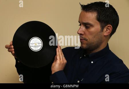 The record that launched The Beatles, One of the rarest and most collectable of all Beatles records is expected to sell for over &pound;10,000 when it comes up for sale next month. The unique ten-inch 78RPM acetate featuring Hello Little Girl on one side and Till There Was You on the other was pressed at the HMV record store on Oxford St London before being presented by the groups manager Brian Epstein to George Martin (EMI) in his desperate attempt to get them a recording contract. Paul Fairweather from Omega Auctions with the record before it is sold.. Stock Photo