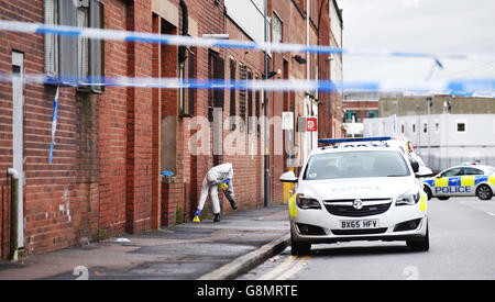 Man shot dead in warehouse robbery bid Stock Photo