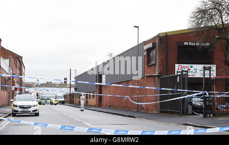 Man shot dead in warehouse robbery bid Stock Photo