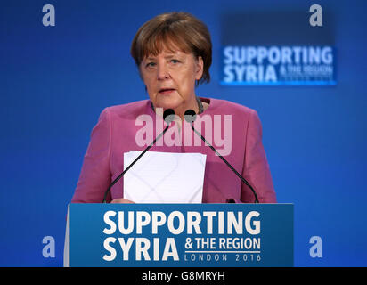 German Chancellor Angela Merkel speaks during the 'Supporting Syria and the Region' conference at the Queen Elizabeth II Conference Centre in London. Stock Photo