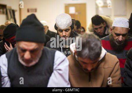 Muslims pray at the Al Furqan Islamic Centre in Glasgow, Scotland, ahead of the launch of Visit my Mosque Day. Stock Photo