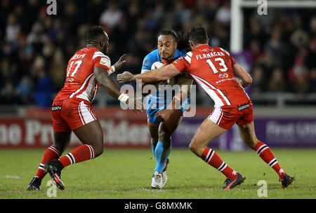 Salford Red Devils' Phil Joseph (left) and Mark Flanagan tackle St Helens' Atelea Vea during the First Utility Super League match at the AJ Bell Stadium, Salford. Stock Photo