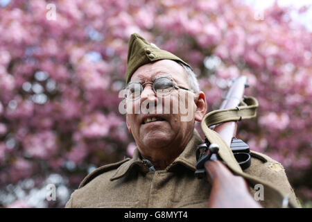 Alan Longthorn poses for a picture dressed in a home guard uniform during the annual 1940's weekend in Haworth, West Yorkshire. Stock Photo