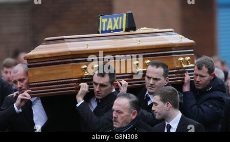 The coffin is carried into Our of Lourdes Church in Dublin for the funeral of Eddie Hutch senior who was shot dead in the north inner city last week. Stock Photo