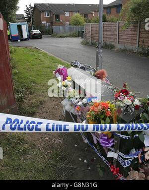 Flowers are left at Terrington Close, Chorlton where a six-year-old boy was found by his father murdered in his bedroom, police said, Thursday 1 September 2005. The schoolboy had been left with a 'family friend' when his father returned home at around 8.30am today and made the grim discovery. Police were called to the scene and a 25-year-old man, not the boy's father, was arrested at a nearby cafe. See PA Story POLICE Boy. PRESS ASSOCIATION Photo. Photo credit should read: Martin Rickett/PA Stock Photo