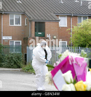 A forensic officer walks past in Terrington Close, Chorlton where a six-year-old boy was found by his father murdered in his bedroom, police said, Thursday 1 September 2005. The schoolboy had been left with a 'family friend' when his father returned home at around 8.30am today and made the grim discovery. Police were called to the scene and a 25-year-old man, not the boy's father, was arrested at a nearby cafe. See PA Story POLICE Boy. PRESS ASSOCIATION Photo. Photo credit should read: Martin Rickett/PA Stock Photo