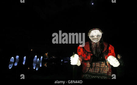 Paper lanterns shaped like giant Bugs and Creatures are lit during the Luminous Landscapes: Spring Festival of Light, a three day festival by Liverpool Lantern Company, at the Festival Garden site at Otterspool, Liverpool. Stock Photo