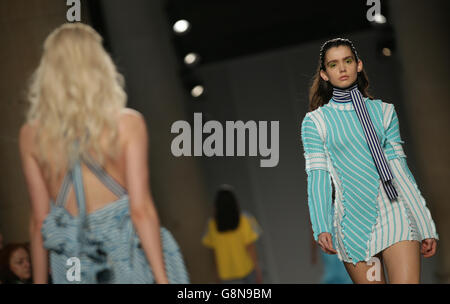 Models on the catwalk during the Richard Malone Fashion East Autumn/ Winter 2016 London Fashion Week show at Topshop Show Space Show Tate Britain, London. Stock Photo