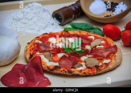 Typical italian pizza made with fresh and genuine ingredients Eden restaurant Sondrio Lombardy Valtellina Italy Europe Stock Photo