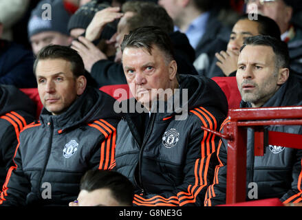 Manchester United manager Louis van Gaal (centre) and Manchester United assistant manager Ryan Giggs and assistant coach Albert Stuivenberg (left) in the dugout during the UEFA Europa League match at Old Trafford, Manchester. Stock Photo
