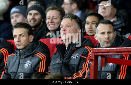 Manchester United manager Louis van Gaal (centre) and Manchester United assistant manager Ryan Giggs and assistant coach Albert Stuivenberg (left) in the dugout during the UEFA Europa League match at Old Trafford, Manchester. Stock Photo