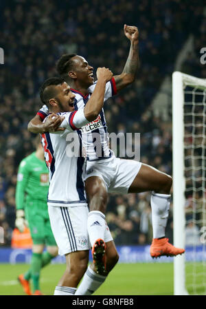 West Bromwich Albion's Saido Berahino (right) celebrates scoring his side's third goal of the game with teammate Jose Salomon Rondon during the Barclays Premier League match at The Hawthorns, West Bromwich. Stock Photo